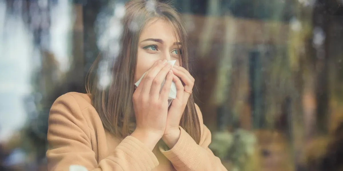 young woman got nose allergy, flu sneezing nose
