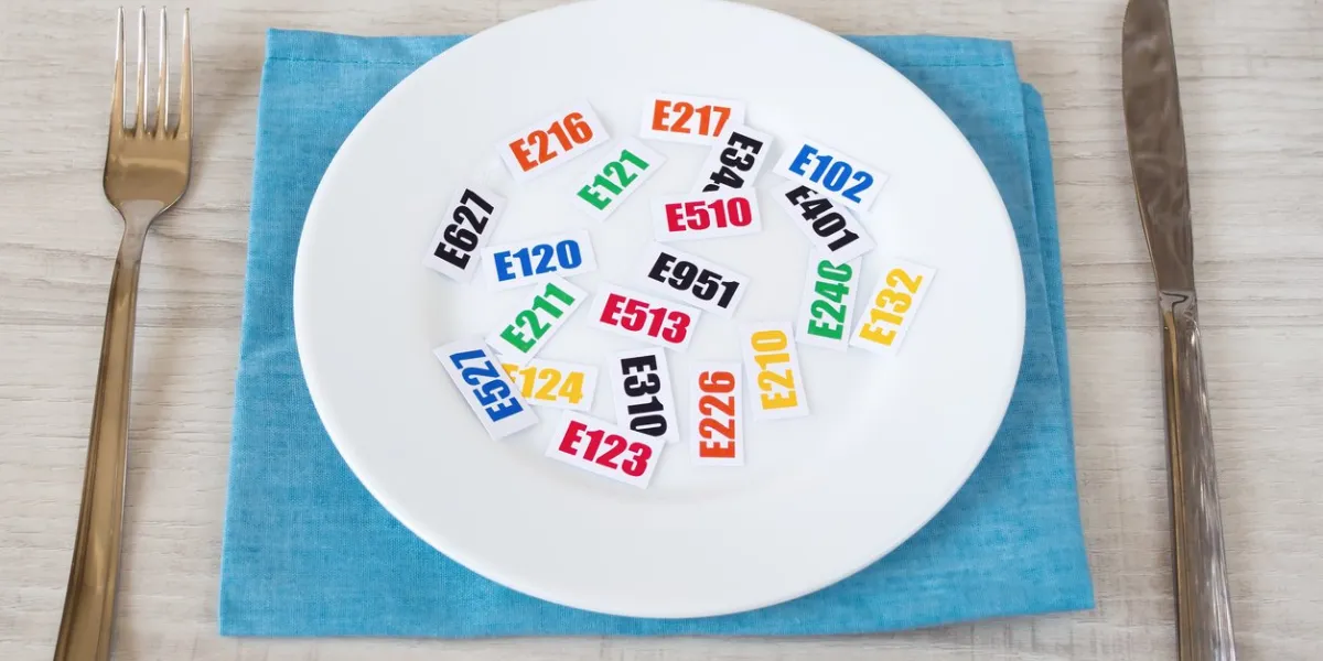 harmful food additives there are several tables with the code e-additives on the plate