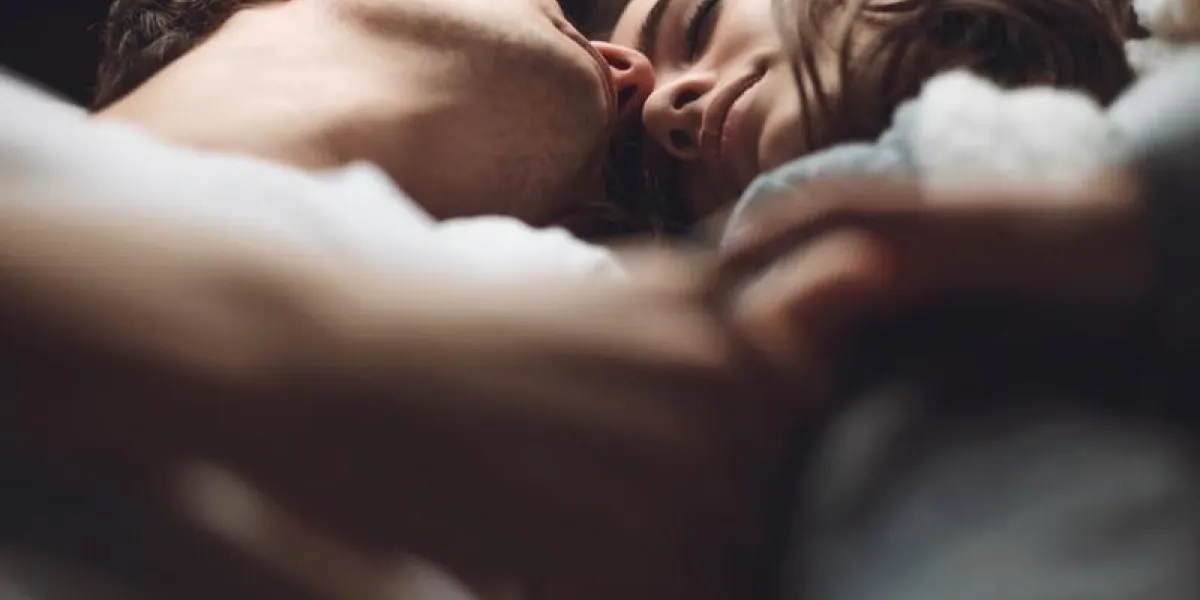 young beautiful pair of lovers hug and kiss