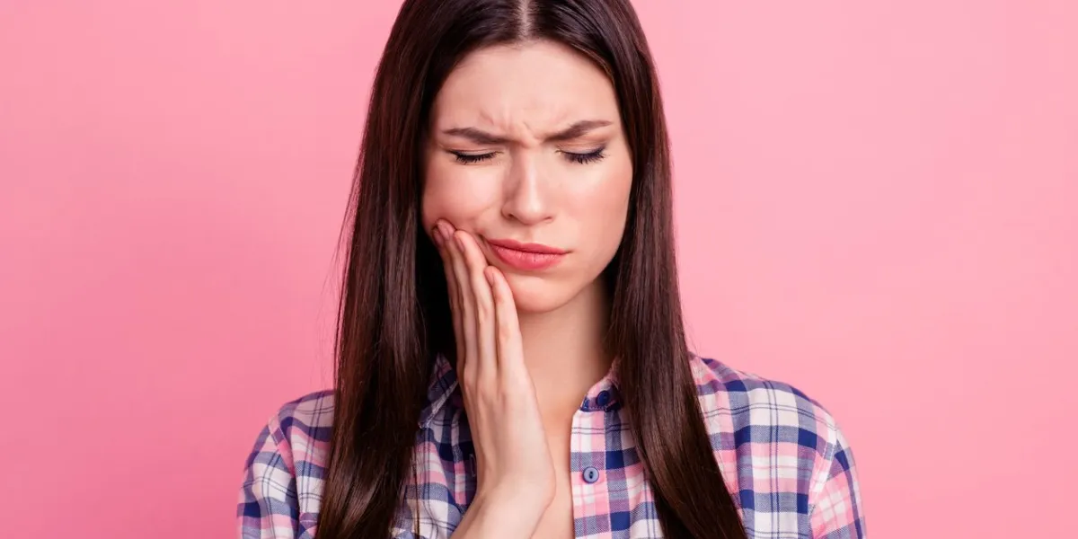 close-up portrait of her she nice attractive cute charming sad straight-haired lady having pain attack teeth damage painkiller meds closed eyes isolated over pink pastel background