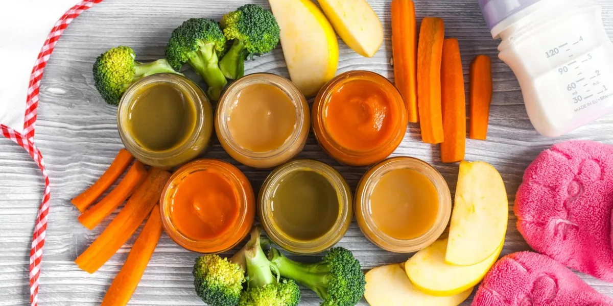 baby vegetable puree on wooden background top view