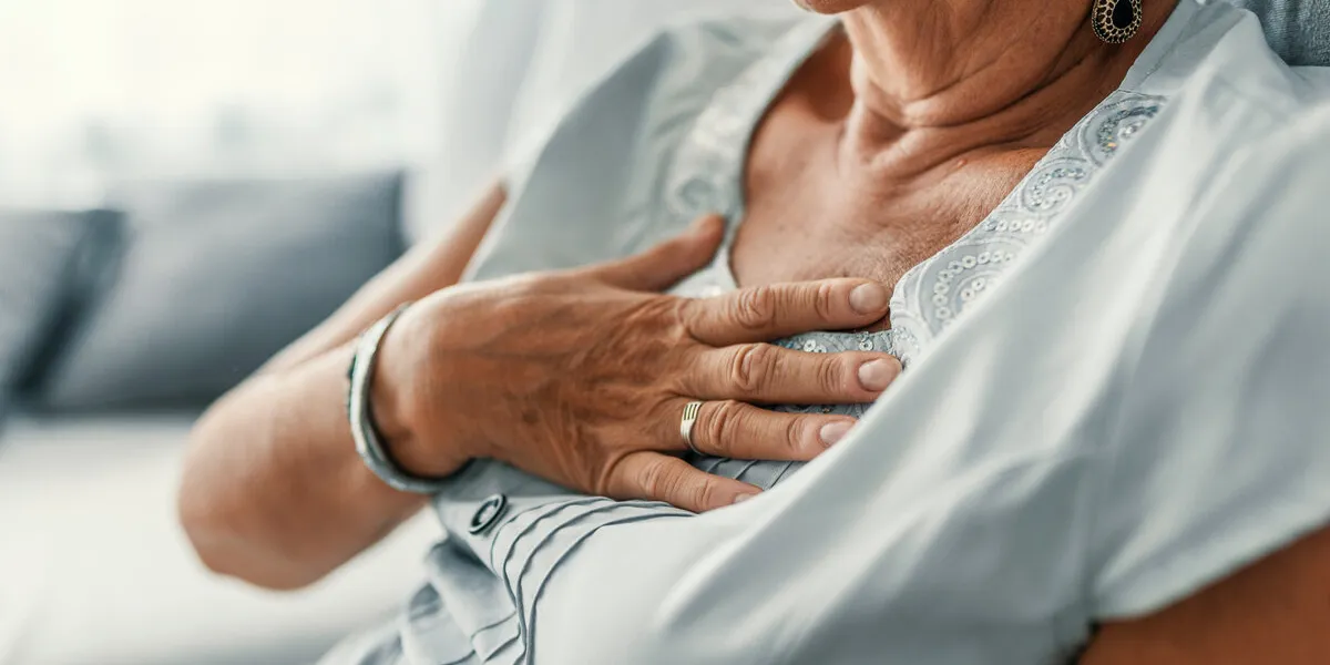female with chest pain senior woman suffering from heartburn or chest discomfort symptoms acid reflux or gastroesophageal reflux disease (gerd) concept