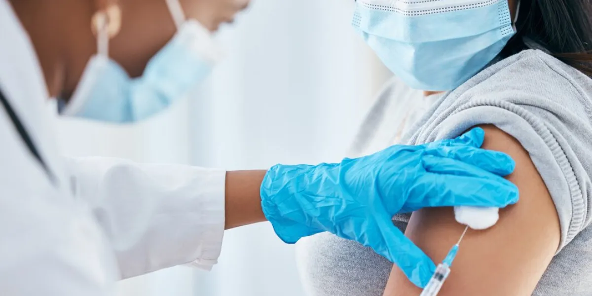 healthcare, covid vaccine injection and woman with doctor with surgical gloves in hospital or clinic healthcare, medical insurance and vaccination innovation, global infection safety in medicine