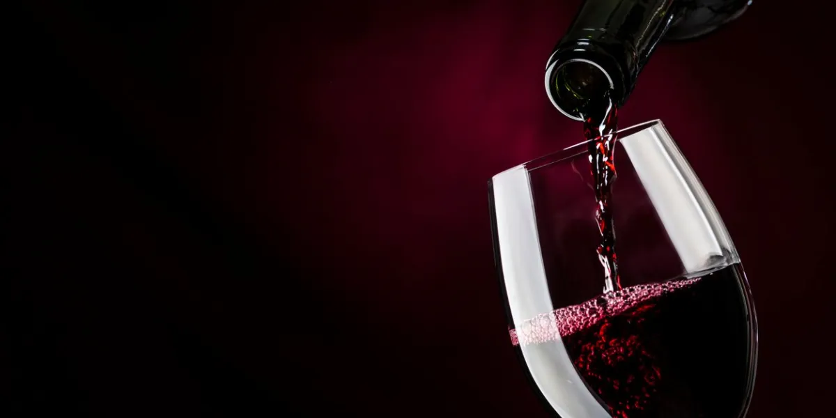 pour wine in a glass