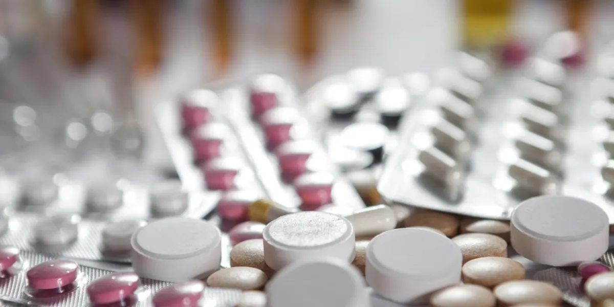 medical marketing pile of pills in blister packs background selected focus with copy space for your text