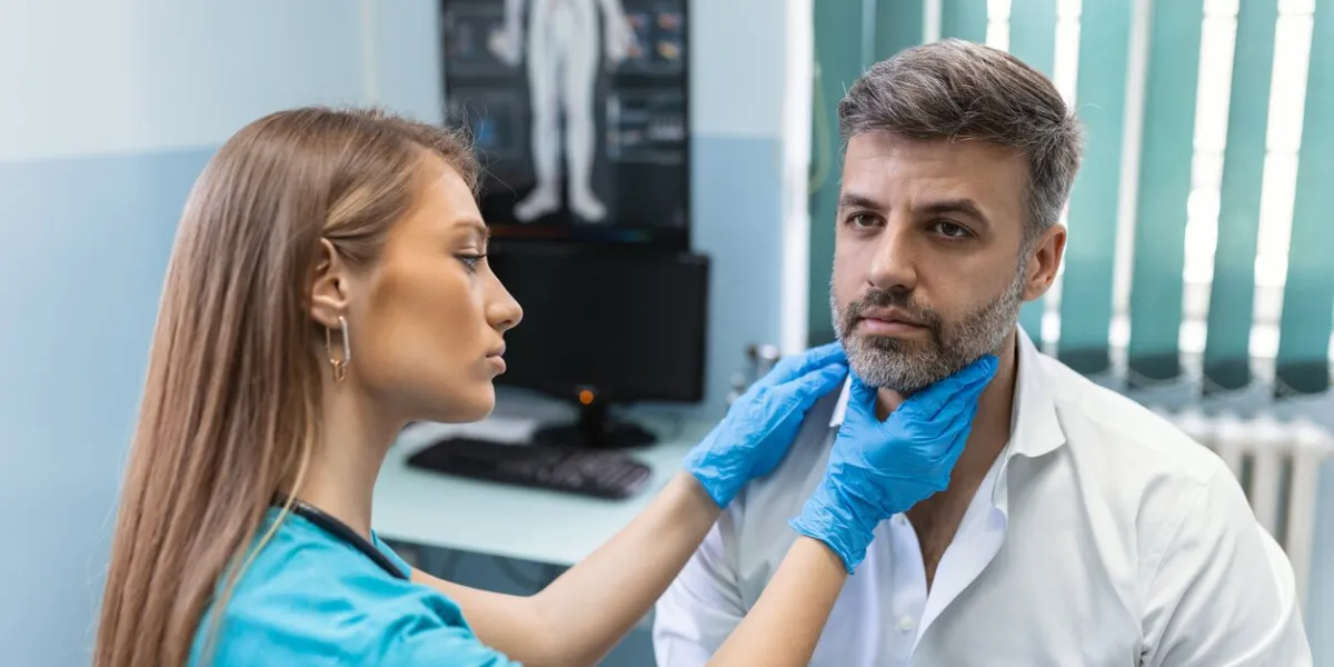 concept of professional consultation in therapist system close up portrait of doctor woman examining tonsils of man in medical office