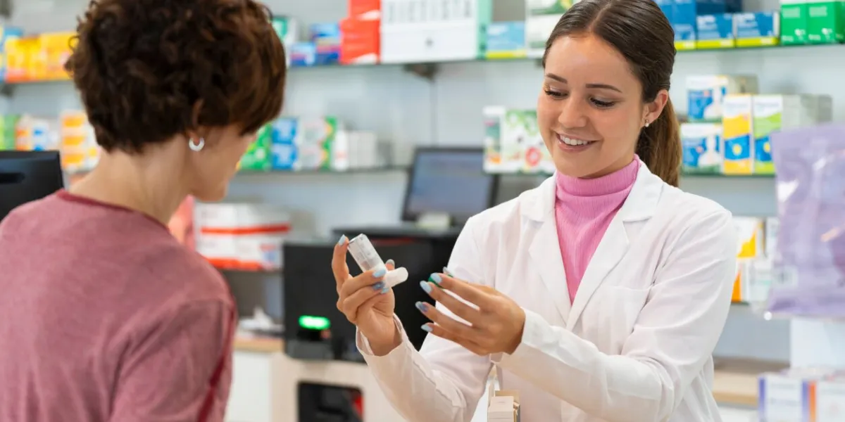 a female pharmacist talking with a female customer about a products choice