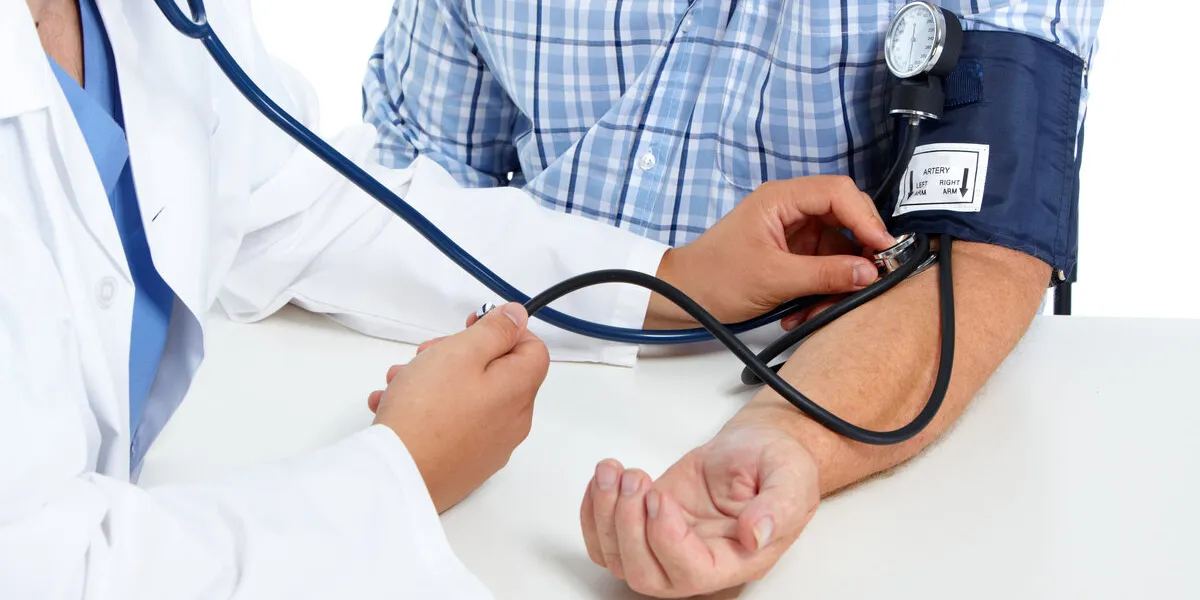 doctor checking old man patient arterial blood pressure health care