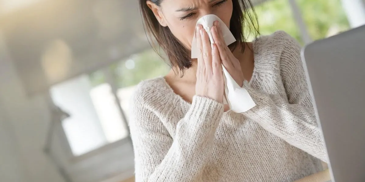 woman at work having a cold