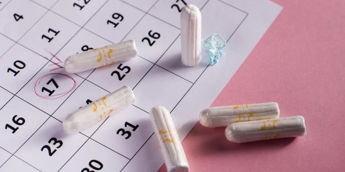 clean white tampons on pink background