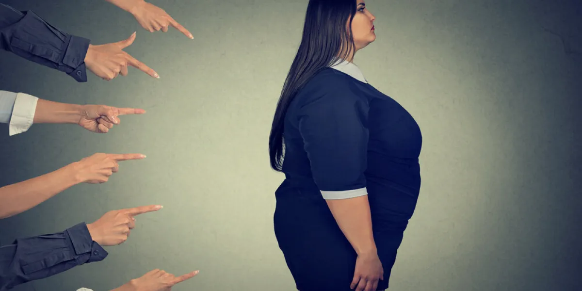 many fingers pointing at fat woman