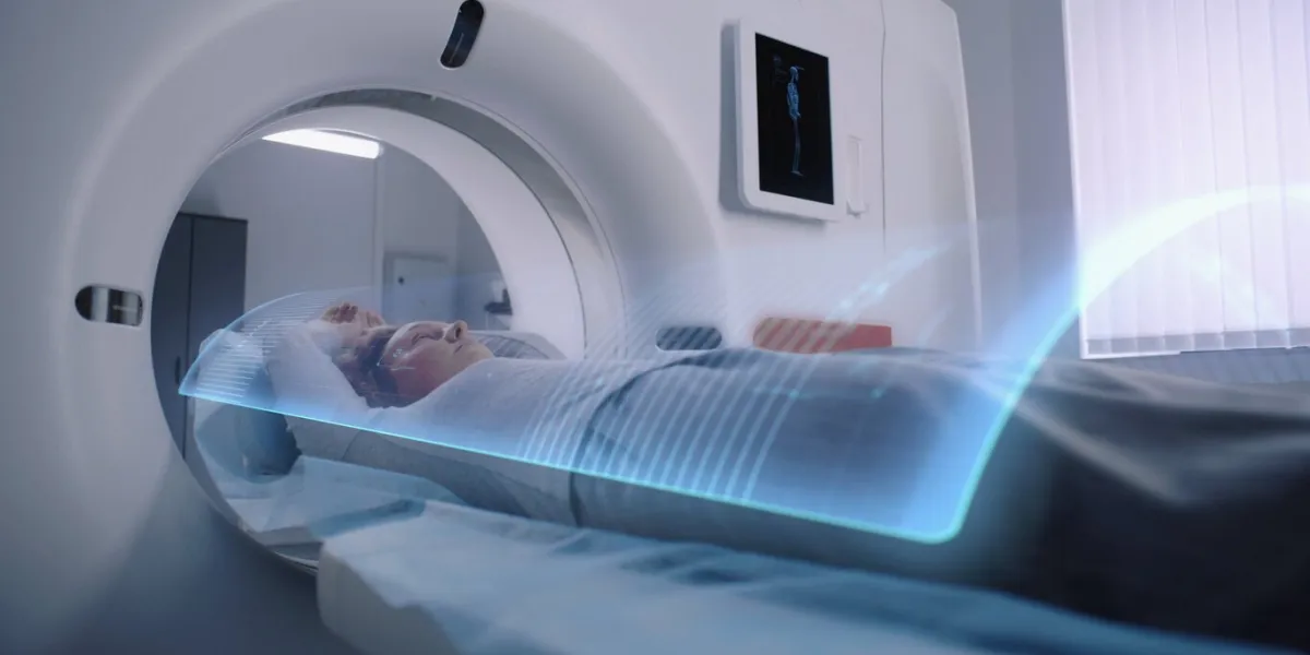 woman undergoes mri or ct scan diagnostic, lies on bed moving inside the machine vfx animation of scanning brain and body of female patient sci-fi augmented reality equipment in modern medical lab