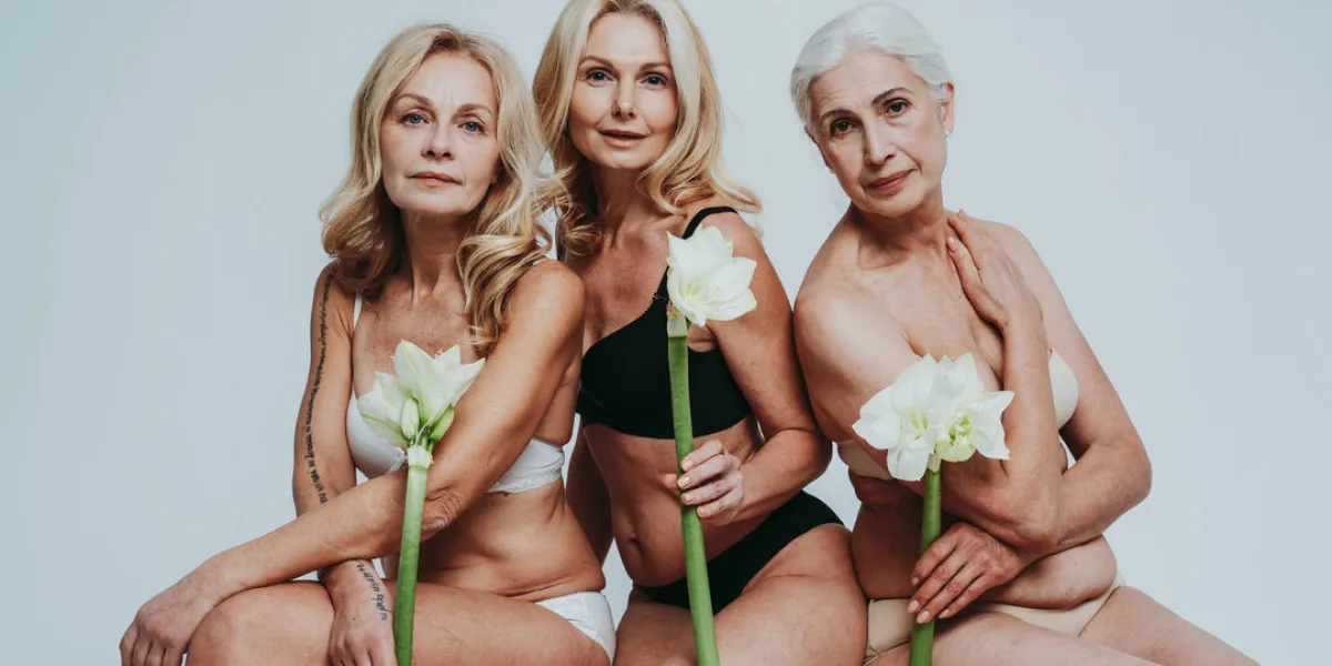 cincematic image of a beautiful senior women group posing on a beauty photo session middle aged women in lingerie on a grey background concept about body positivity, self esteem, and body acceptance