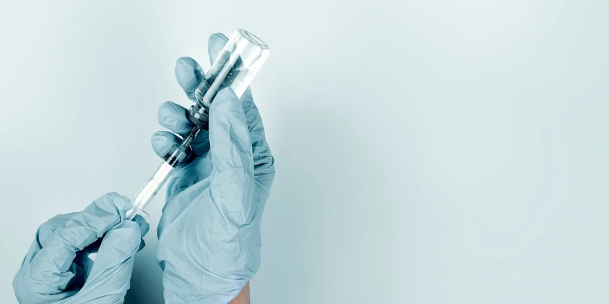 injecting injection vaccine vaccination nurse preparing coronavirus vaccine injection for patient healthcare and medicine concept