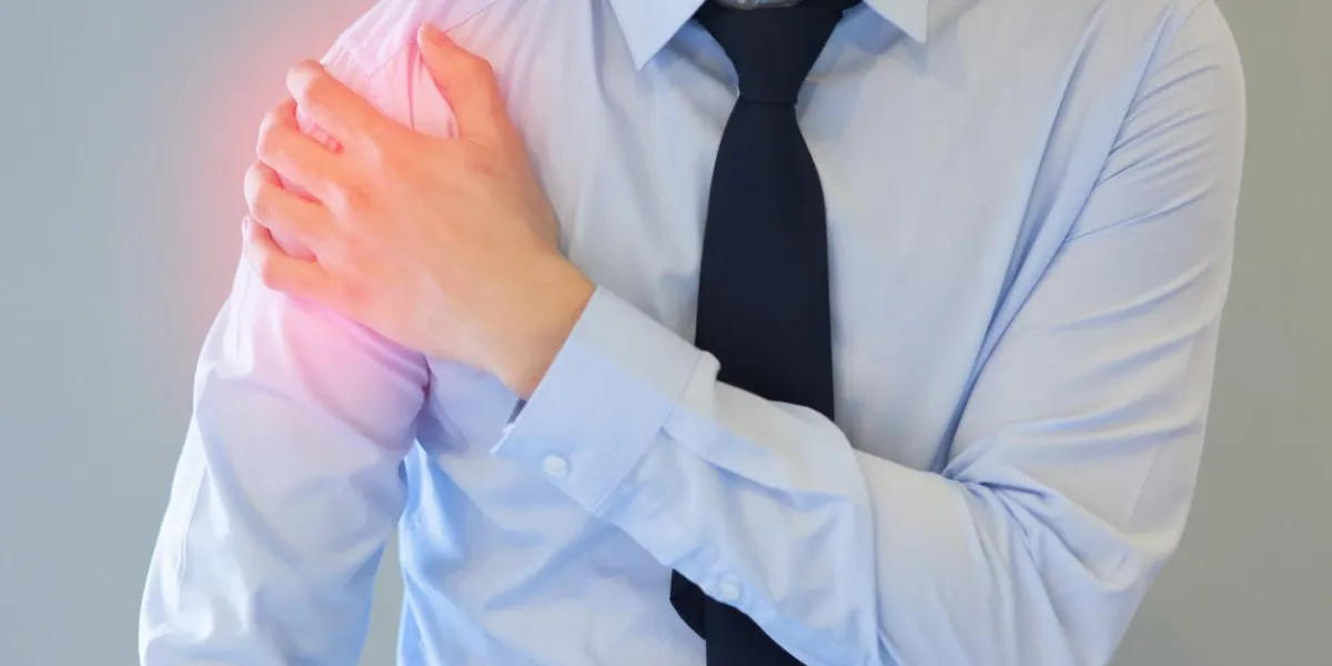 man having shoulder pain problem with red spot