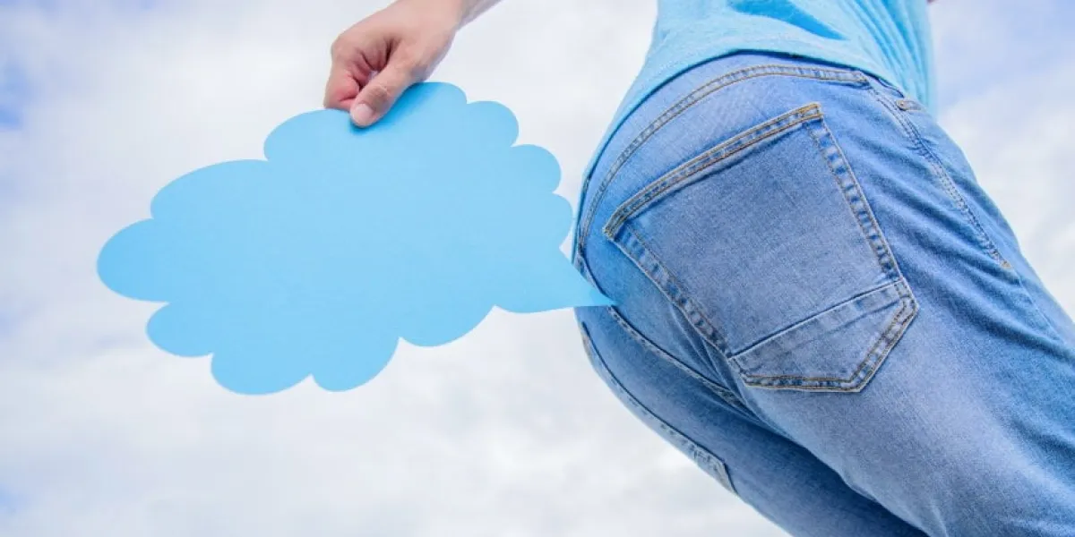 fart will blow you away farting bubble going out of bottom empty speech bubble near male buttock blowing fart suffering from bloating and flatulence, copy space