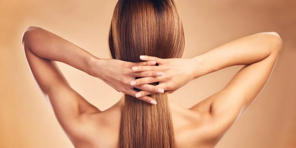 studio, back and person with long hair care, healthy texture shine and strong extensions, cosmetic treatment or keratin results hairdressing spa, beauty salon and model hairstyle on brown background