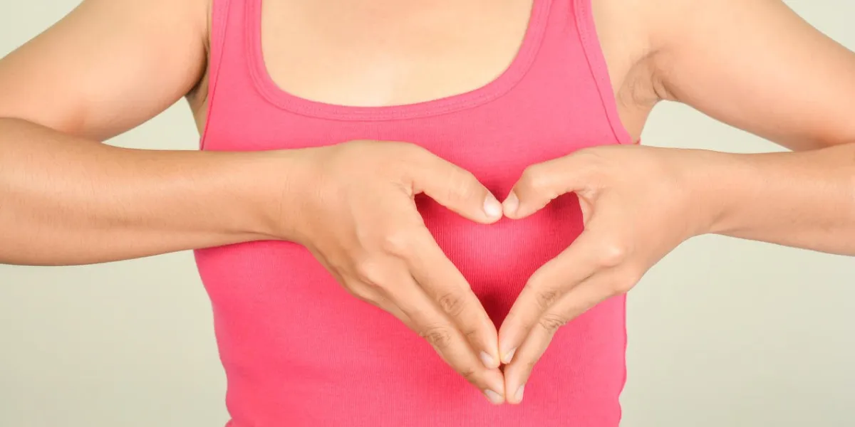 symbol hand with heart woman  and pink shirt