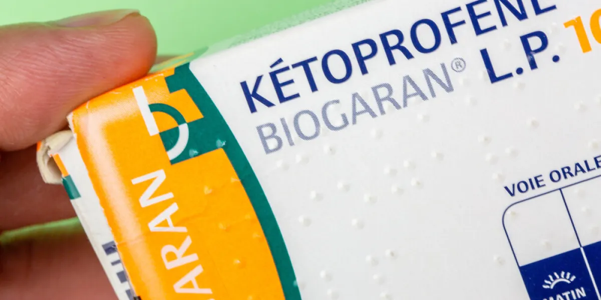 benon, france - november 10, 2019 closeup on box of ketoprofen held in hand this drug is a powerful analgesic used against major pain such as tendinitis, lumbago, sciatica etc