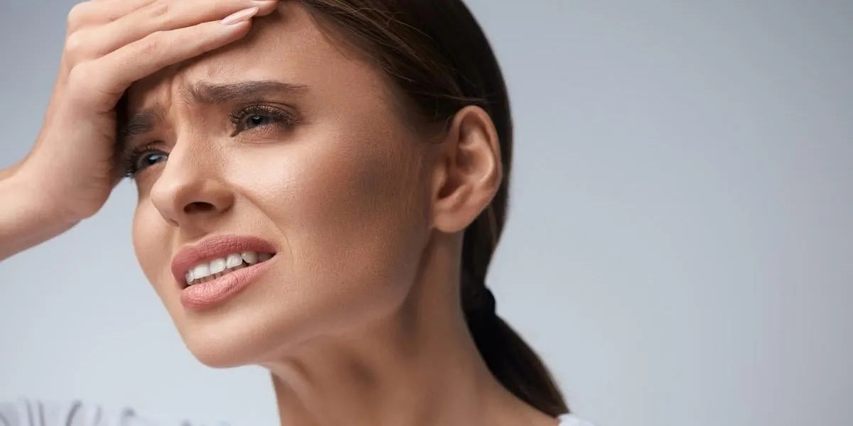 health woman in pain feeling bad and sick, having headache and fever, holding hand on forehead beautiful unhappy tired girl suffering from painful head ache and stress healthcare high resolution