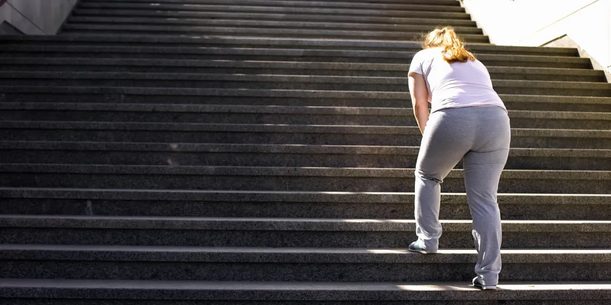 hard to climb stairs for obese girl, victory over fatigue for goal achieving