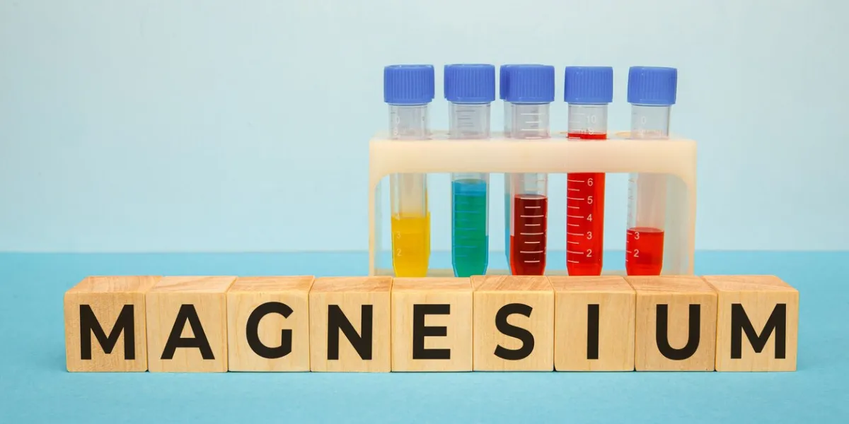 magnesium word on wooden cubes, mineral complex or supplement for a healthy lifestyle, medical concept