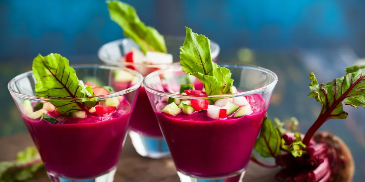 beetroot gazpacho soup with cucumber and radish in glassessoft focus