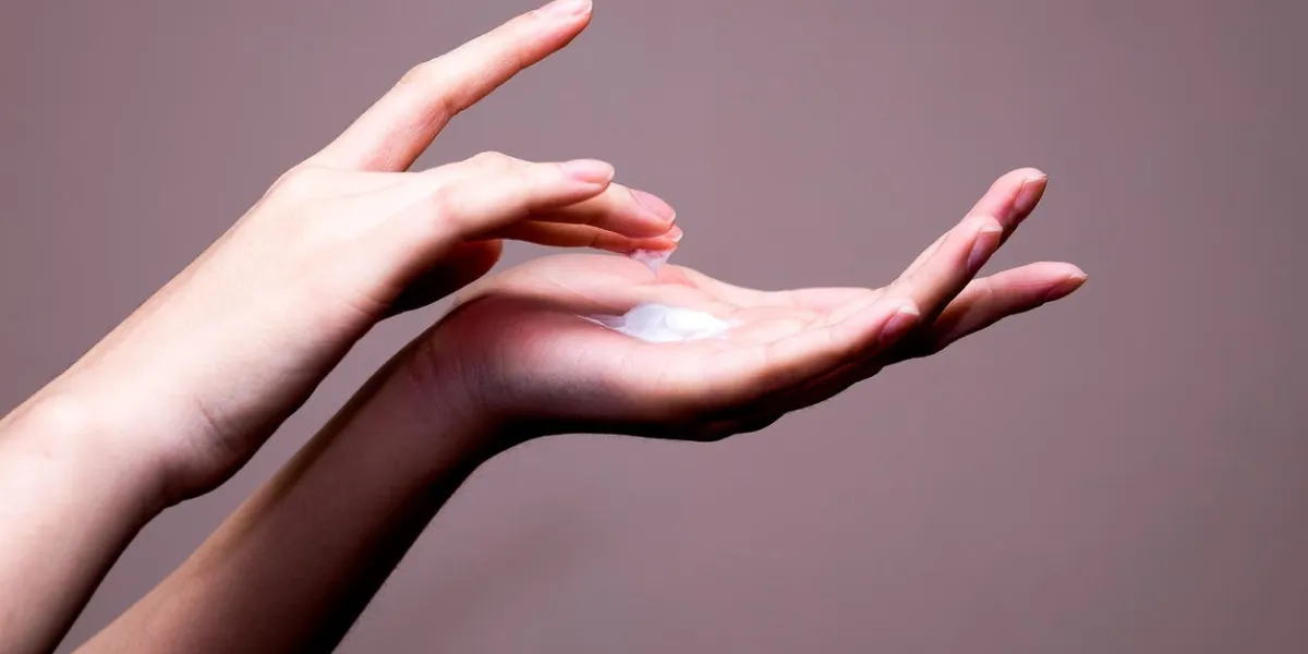 beautiful woman hands with cream