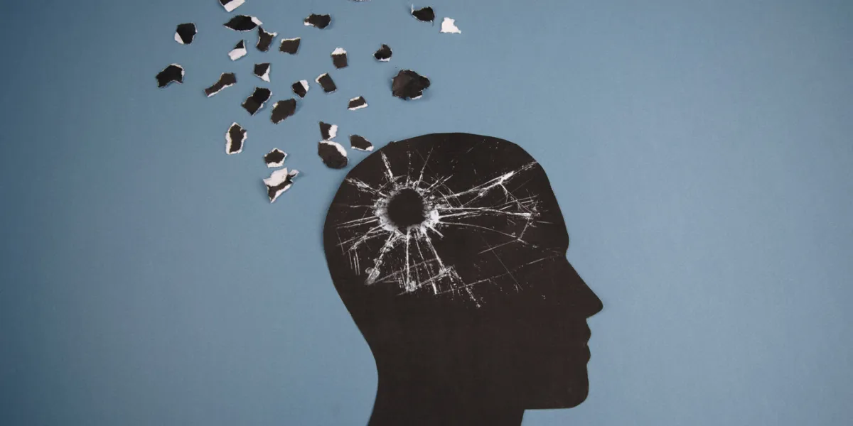 brain disorder symbol presented by human head made form paper creative idea for alzheimer's disease, dementia, memory loss and mental health concept