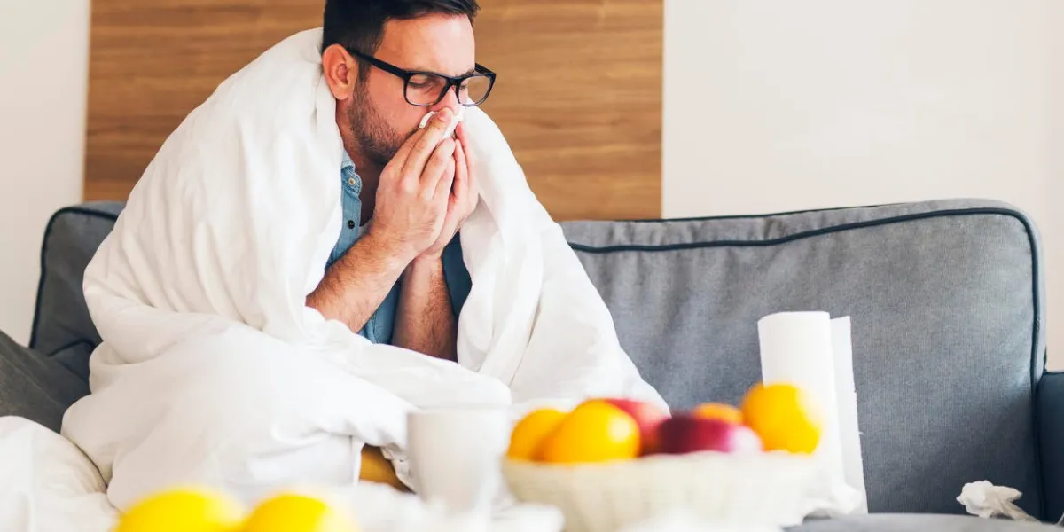 young man suffering from cold at his home