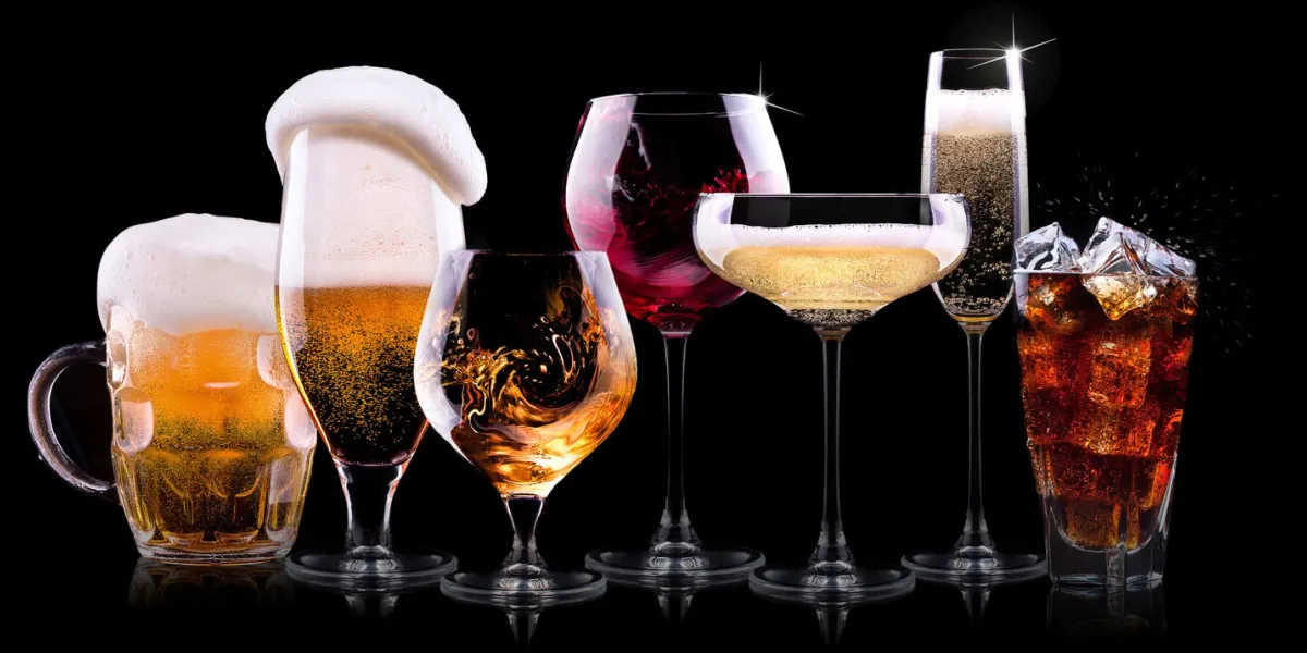 set with different drinks on black background - champagne, beer, cocktail, wine, brandy, whiskey, scotch, vodka, cognac