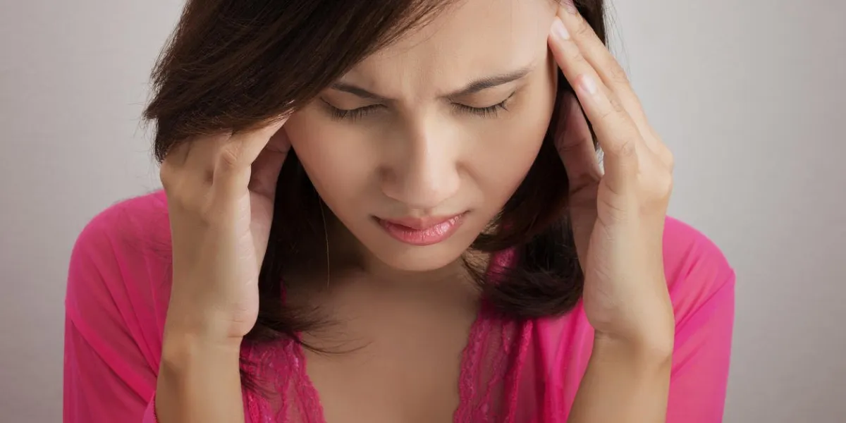 close up portrait of woman with headache