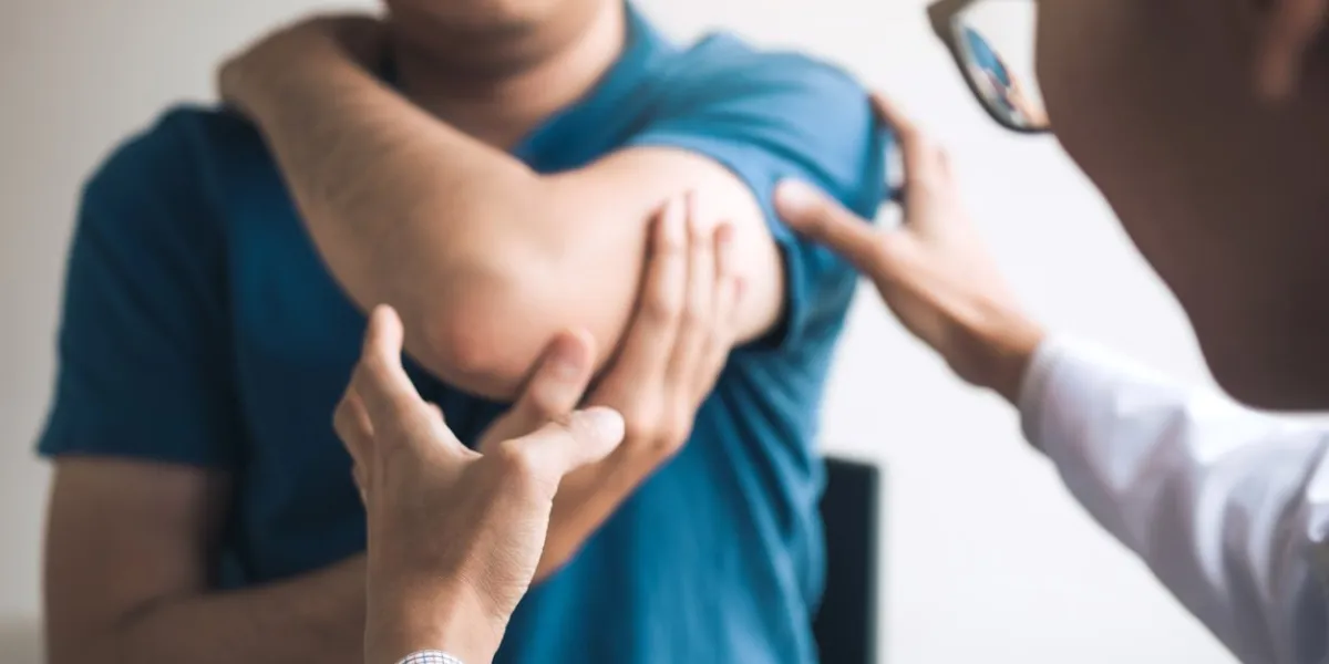 physical therapists are checking patients elbows at the clinic office room