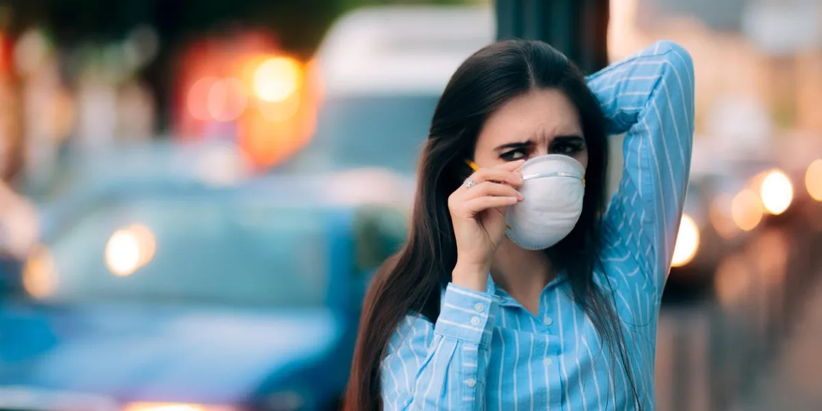 worried girl fighting urban pollution with safety measures