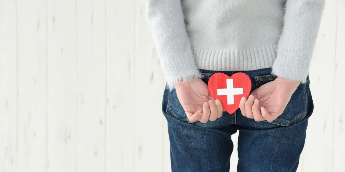 woman having heart object on buttocks