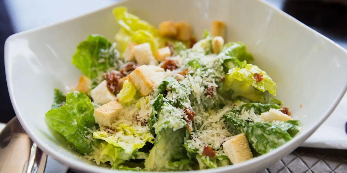 classic fresh ceasar salad with bacon bits