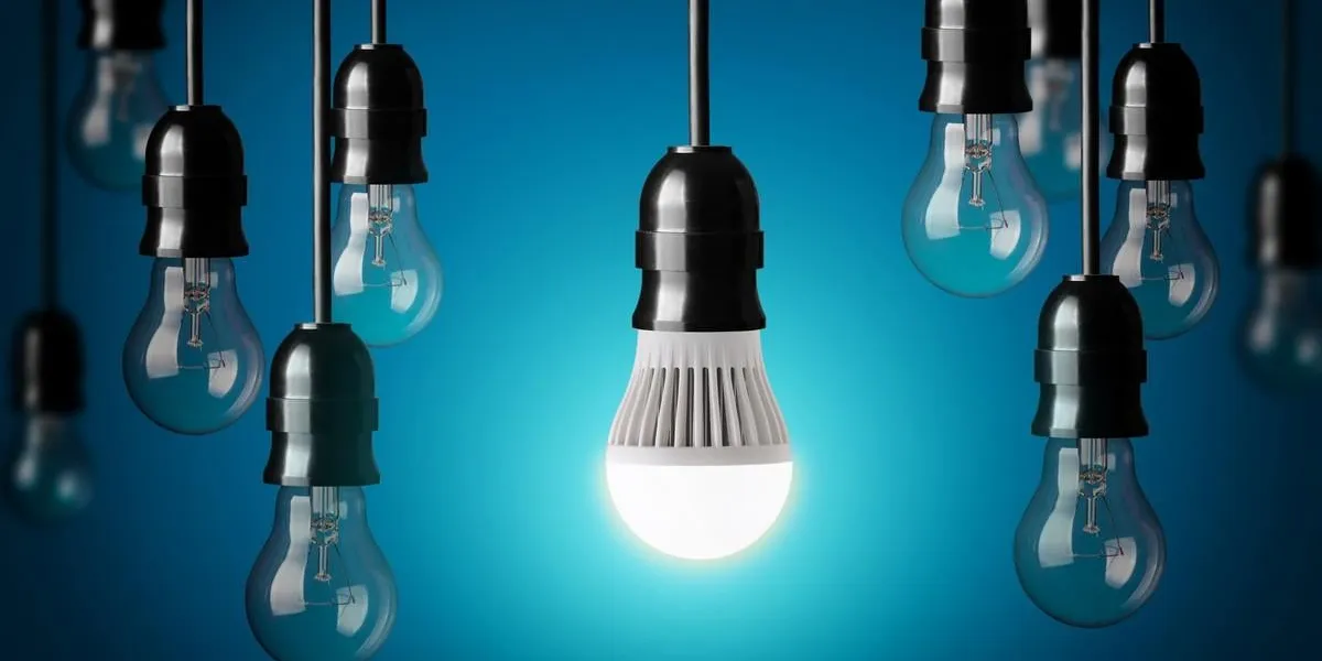 led bulb and simple light bulbsblue background