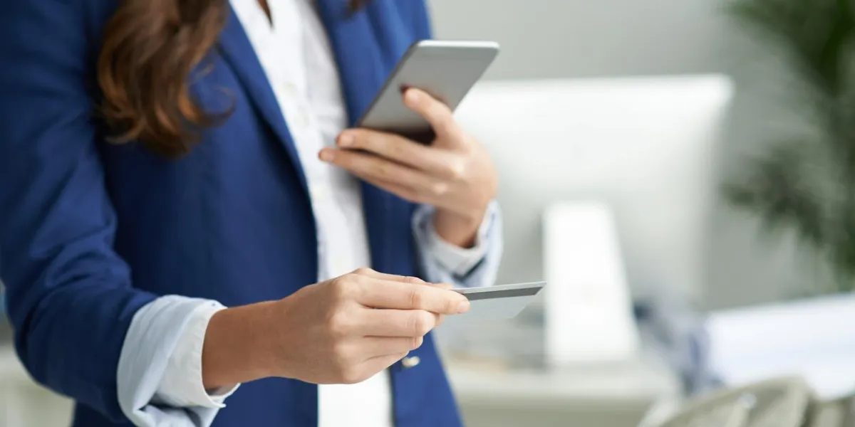 cropped image of business lady using credit card to pay for online purchase