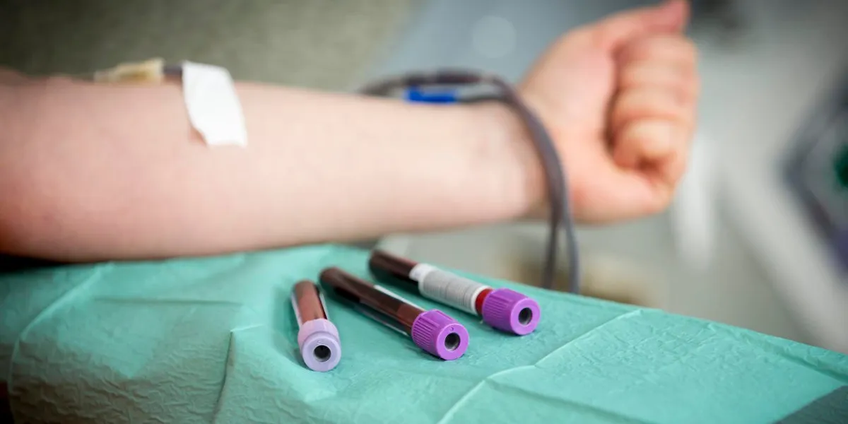 the hand of a woman who donates blood female donor gives blood in a mobile blood donation center blood samples
