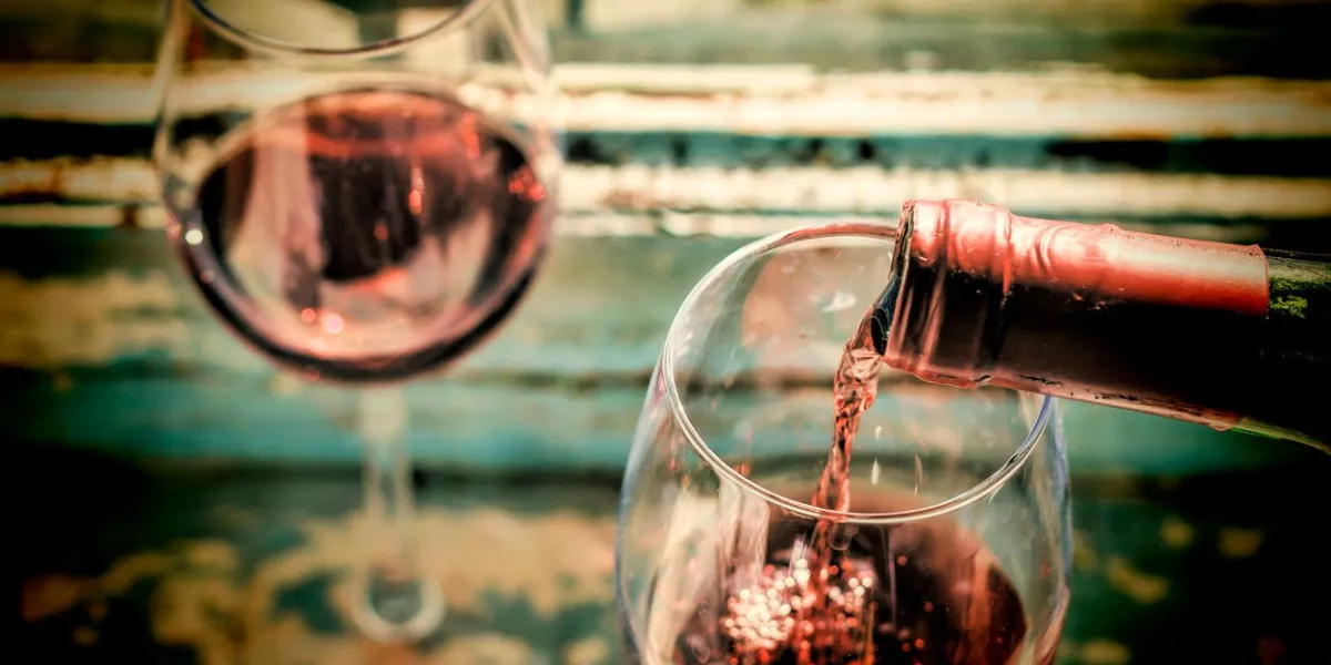 pouring wine into a glass style vintage valentine's day