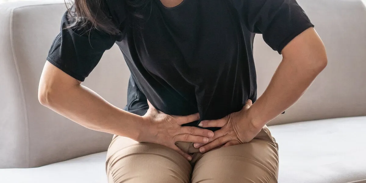 abdominal pain in woman with stomachache illness from menstruation cramps, stomach cancer, irritable bowel syndrome, pelvic discomfort, indigestion, diarrhea or gerd (gastro-esophageal reflux disease)