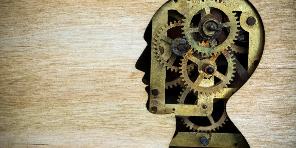 human head silhouette model made from rusty metal gears