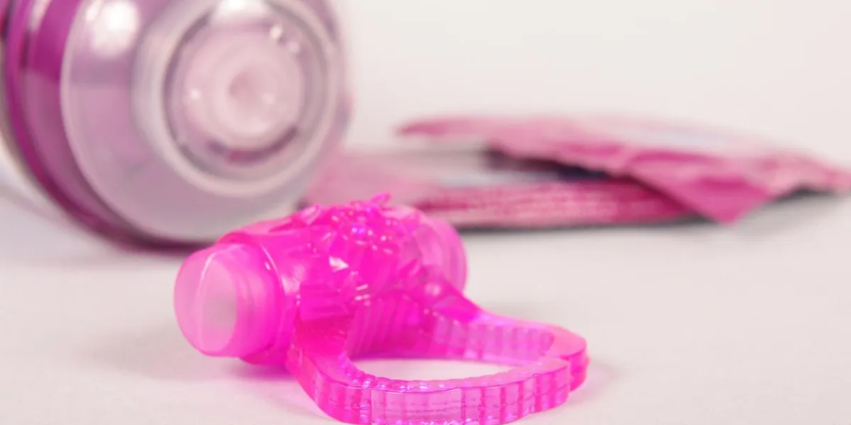 penis ring and condoms isolated on the white background