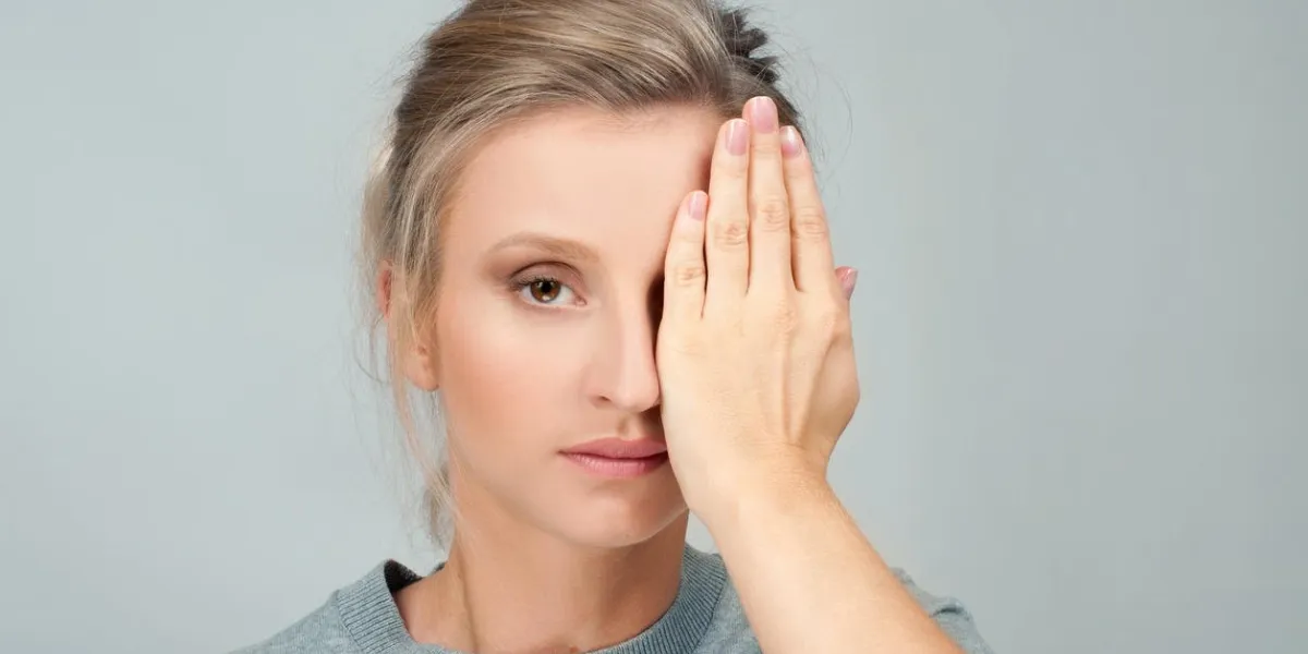 patient doing an eye checkup woman closing her left eye