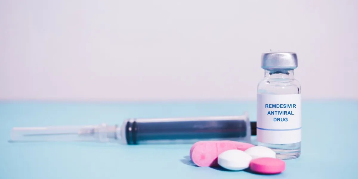 remdesivir antiviral drug with pills and syringe as background - concept of covd-19 or coronavirus new possible antiviral drug medication