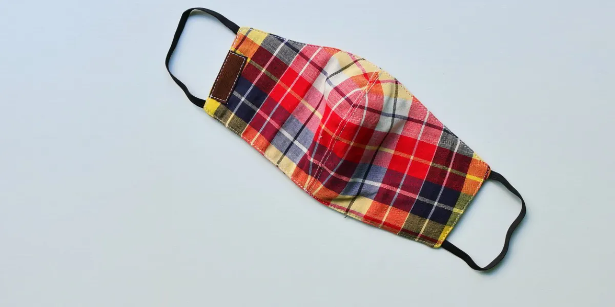 closeup handmade face mask made from plaid cloth, washable and reusable, can be used during shortage of surgical mask due to coronavirus outbreak