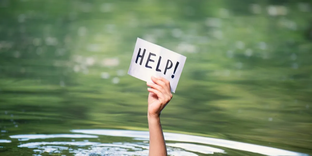drowning victim, hand with help sign, danger of swimming in lake or river, struggle to survive, failure and rescue in waters