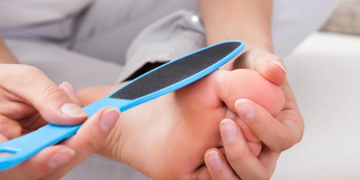 close-up of woman having pedicure to her legs