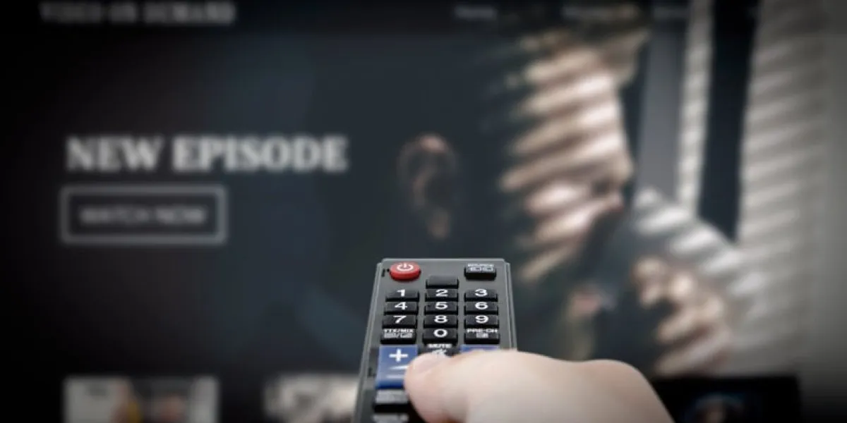 vod service on television man watching tv, streaming service, video on demand, remote control in hand