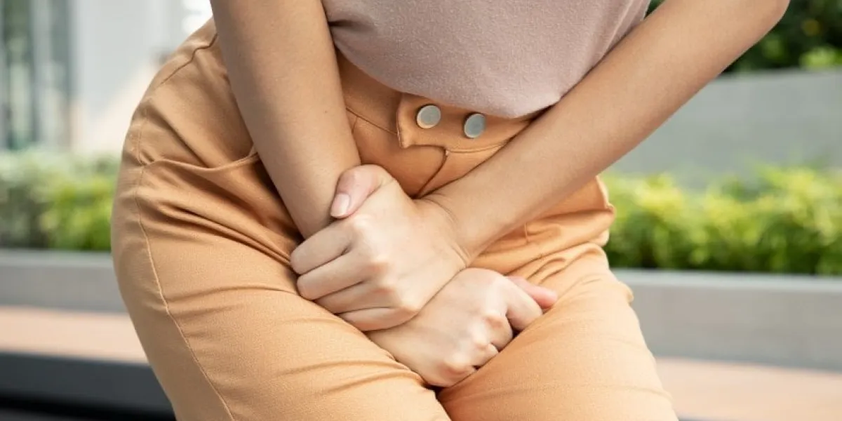 woman holding her pee, health care concept of urinary tract infection, urinary incontinence, overactive bladder symptoms
